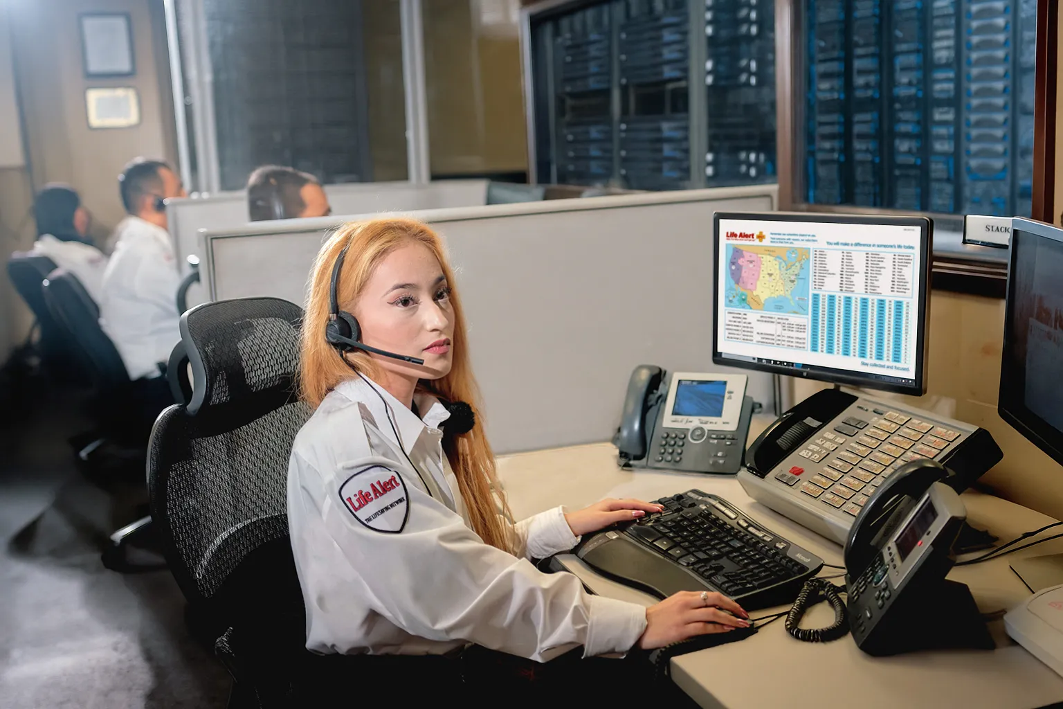 Life Alert emergency response operator assisting members from a 24/7 medical alert dispatch center
