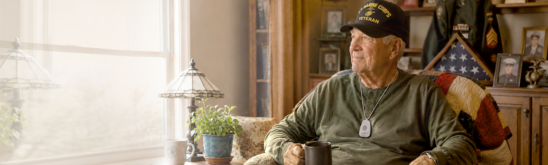 U.S. veteran at home wearing a Life Alert medical alert device.